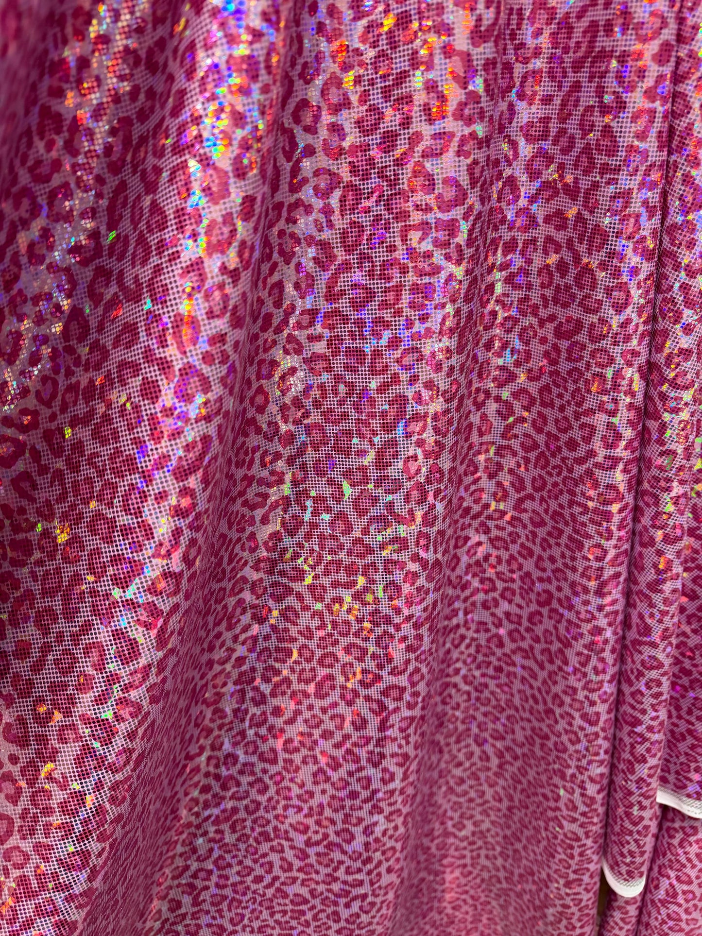 Modern cheetah design print on nylon spandex hologram metallic 4-way stretch 58/60”Sold by the YD.Ships worldwide from Los Angeles CA.