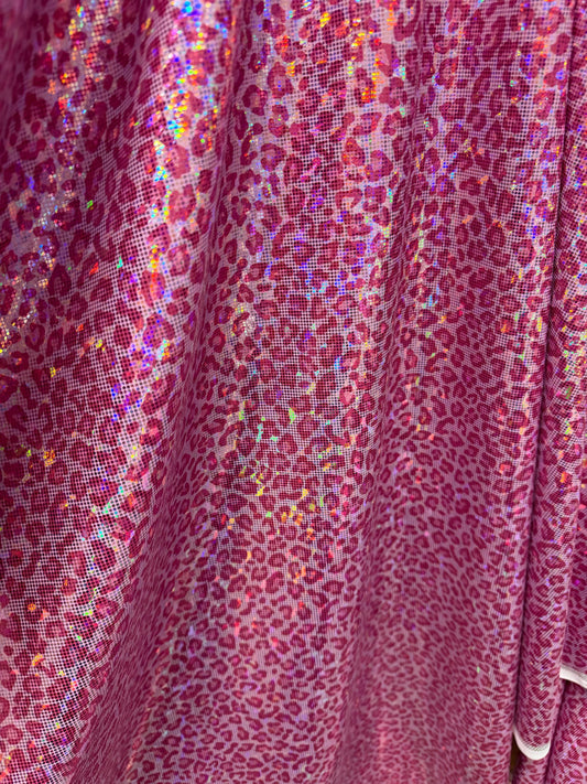 Modern cheetah design print on nylon spandex hologram metallic 4-way stretch 58/60”Sold by the YD.Ships worldwide from Los Angeles CA.