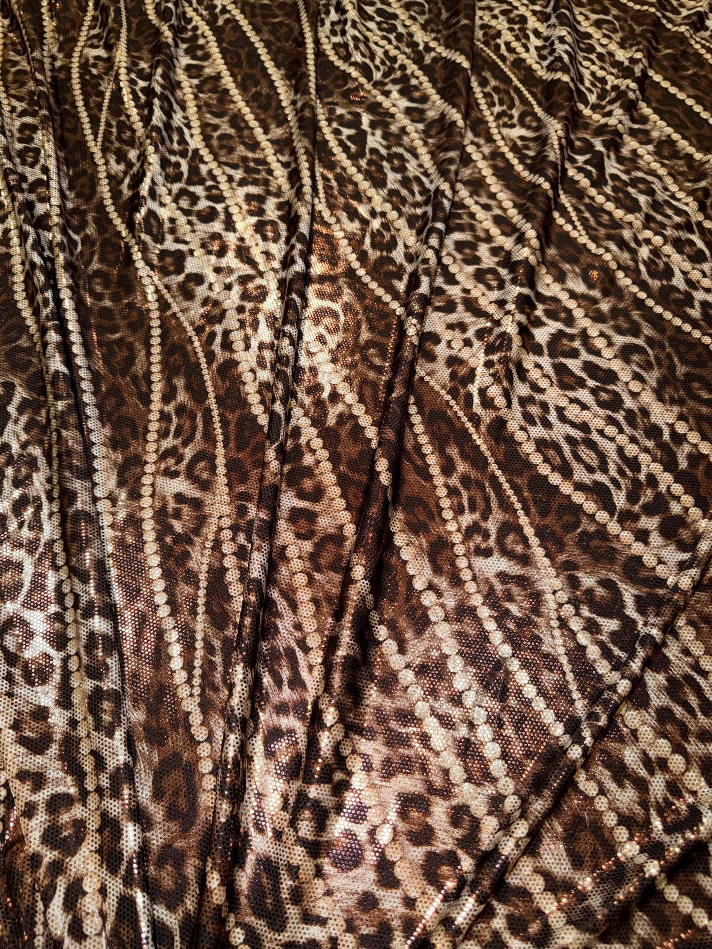 New Skin leopard and pearls design metallic poly spandex 4-way stretch 58/60”Sold by the YD.Ships worldwide from Los Angeles California USA.