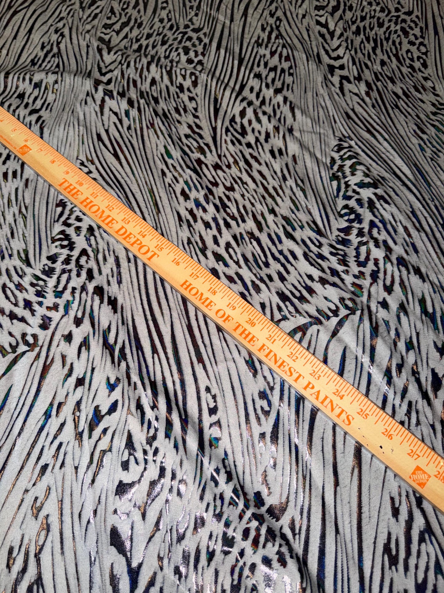 New abstract animal design on metallic hologram nylon spandex4-way stretch 58/60”sold by the YD. ships Worldwide from Los Angeles CA
