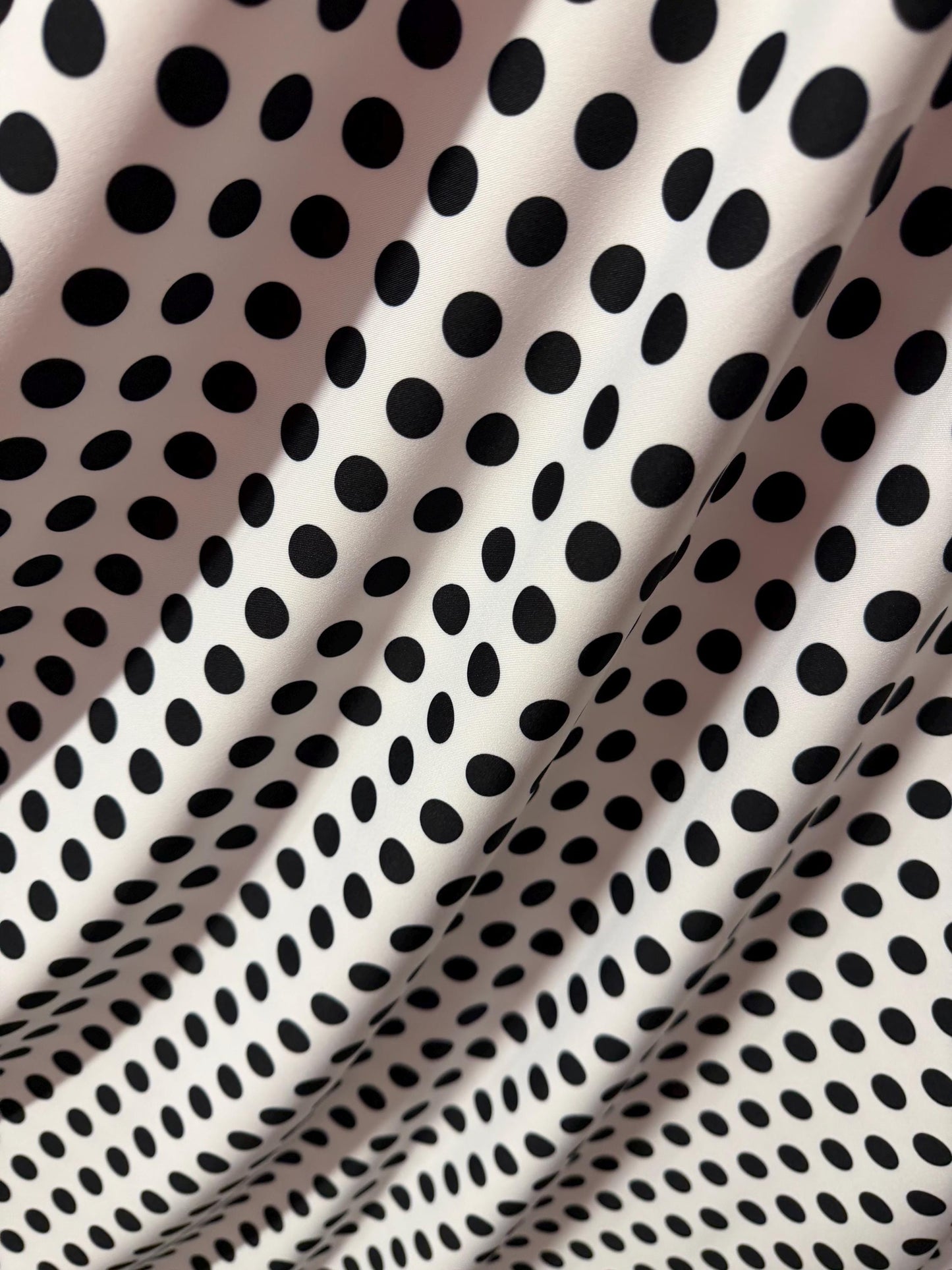 NEW Polka dots white/black design print on best quality of nylon spandex 4-way stretch 58/60”sold by the YD. ships Worldwide from LA.