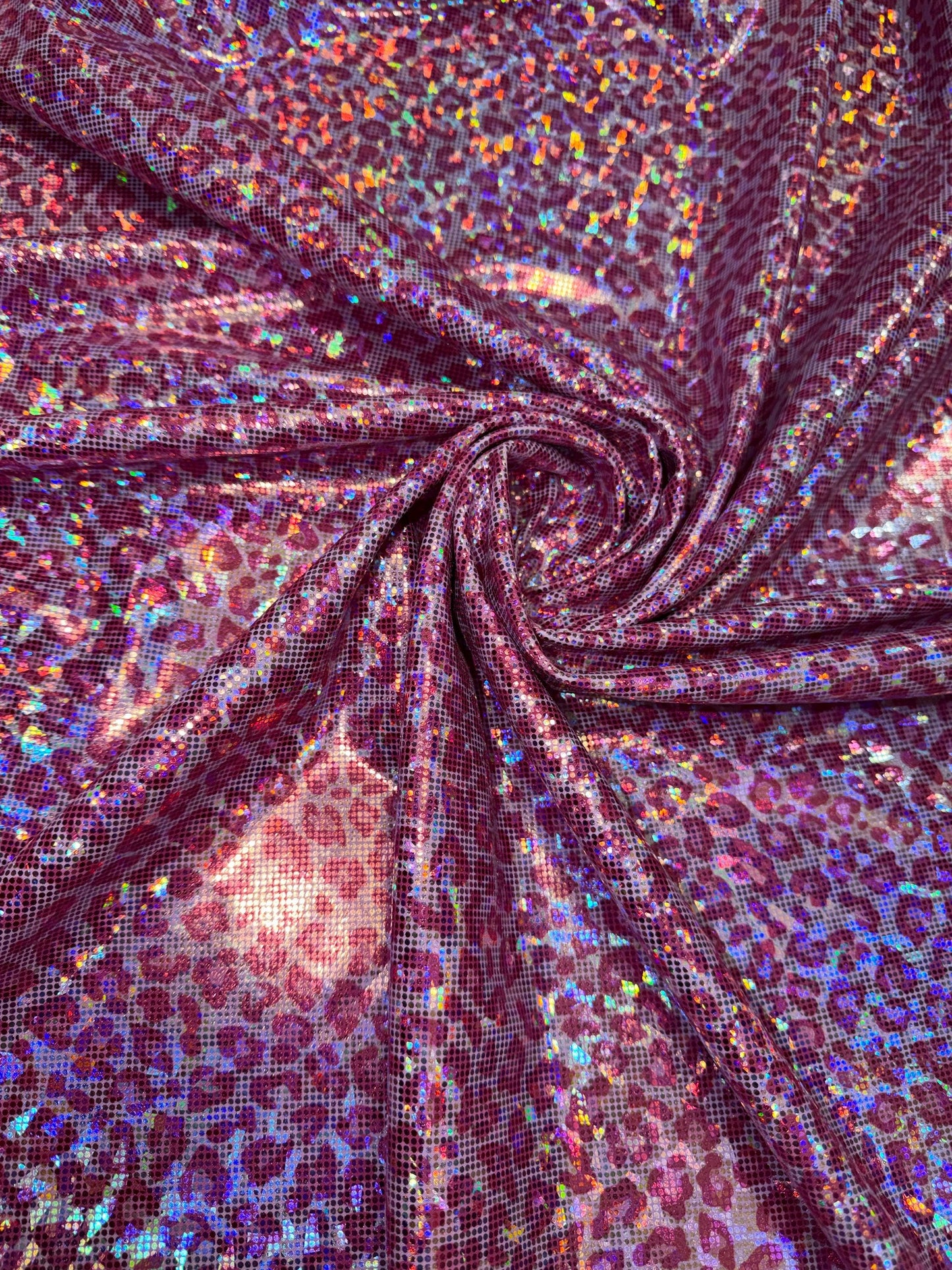 Modern cheetah design print on nylon spandex hologram metallic 4-way stretch 58/60”Sold by the YD.Ships worldwide from Los Angeles CA.