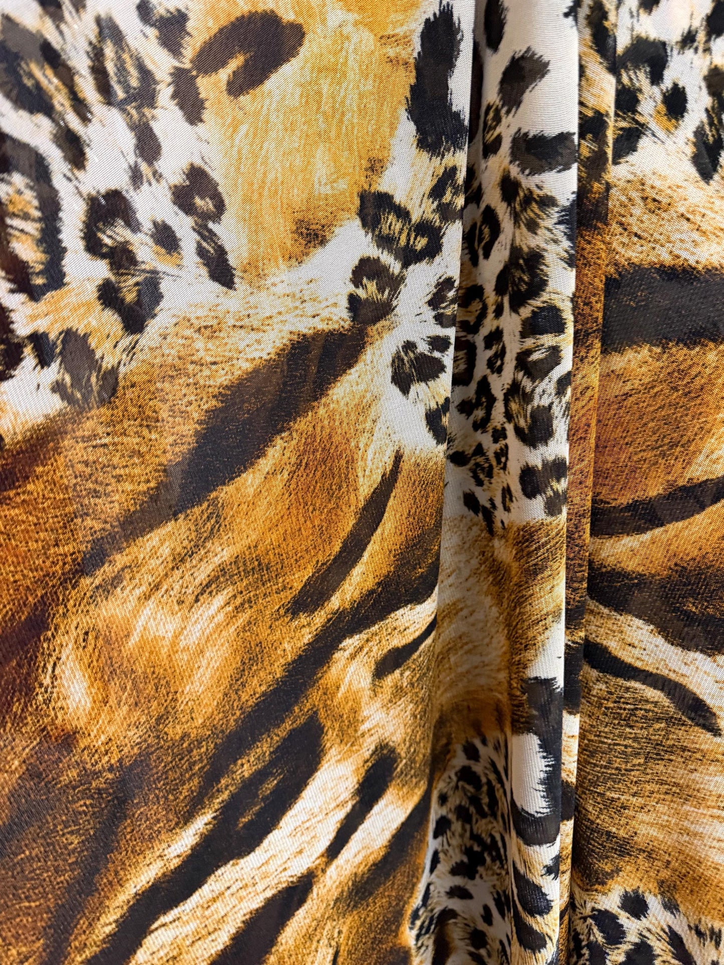 New abstract animal design print on power mesh 4-way stretch 58/60”sold by the YD. Ships worldwide from Los Angeles California USA.