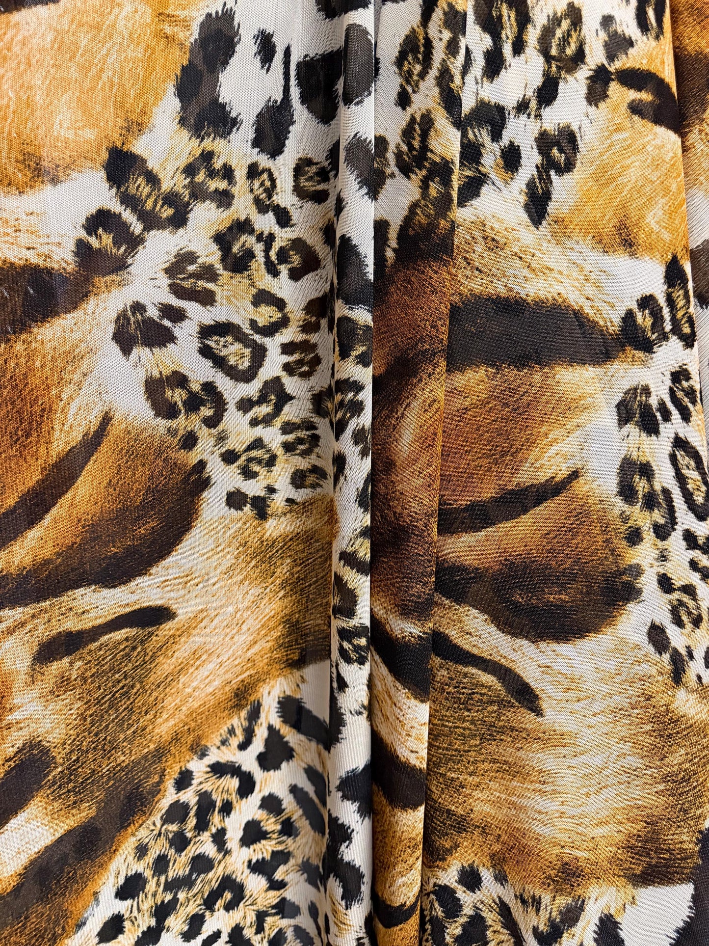 New abstract animal design print on power mesh 4-way stretch 58/60”sold by the YD. Ships worldwide from Los Angeles California USA.