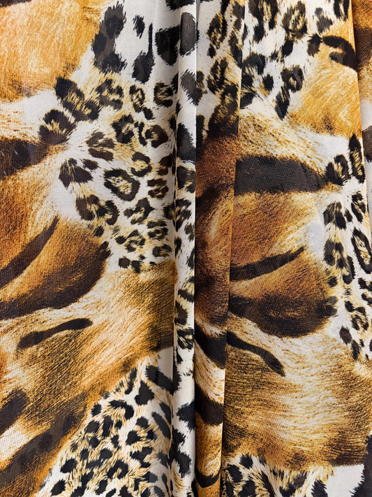 New abstract animal design print on power mesh 4-way stretch 58/60”sold by the YD. Ships worldwide from Los Angeles California USA.