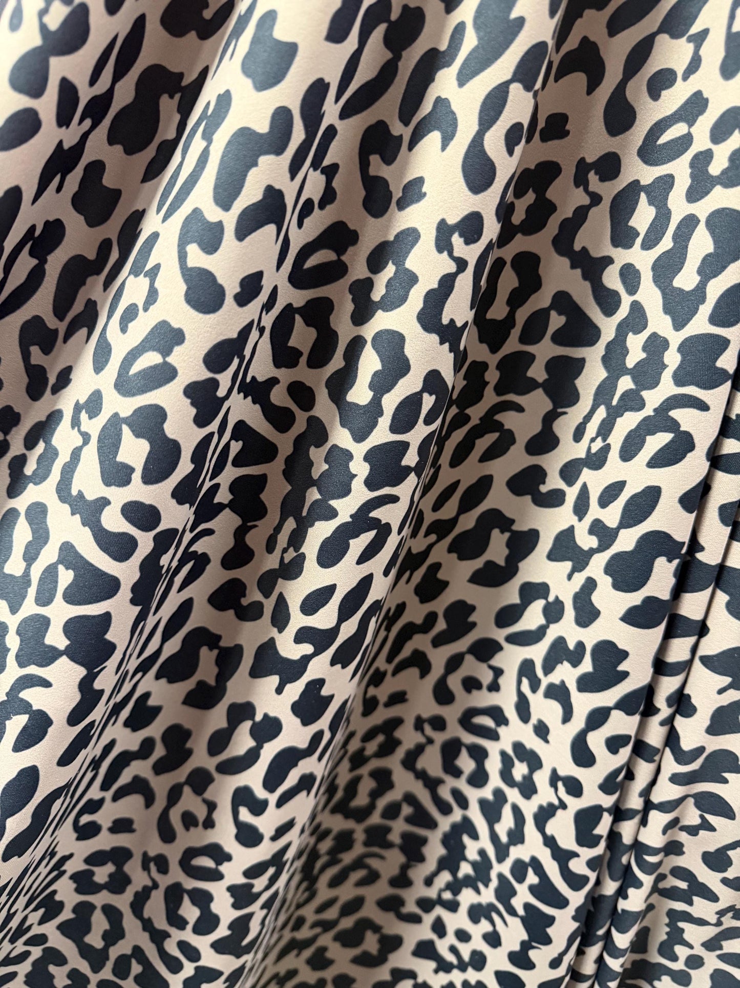 Cheetah Taupe/Black design print on the best quality nylon spandex 4-way stretch 58/60”sold by the YD.ships worldwide from Los Angeles CA